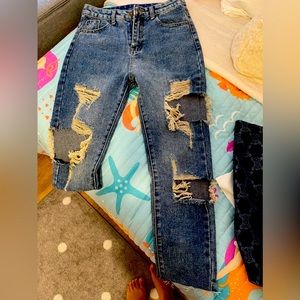 New tattered jeans made in Thailand